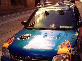 3 men in a little micra